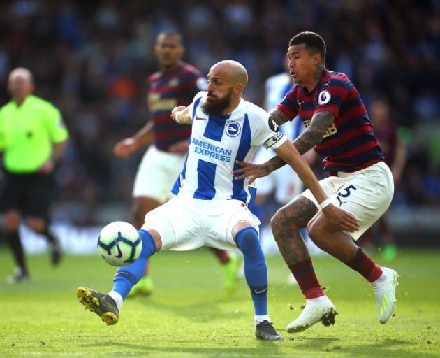 Brighton's Bruno controls the ball as he is defended by Newcastle's Kenedy. Photo: Getty Images