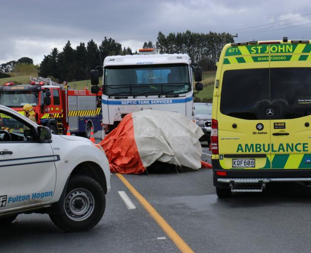 Emergency services at a septic trank truck versus car crash near Crichton, south of Milton on SH1...