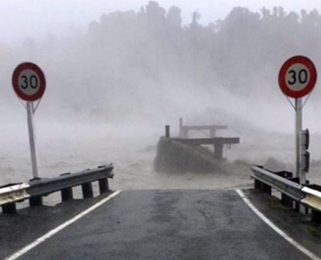 The Waiho Bridge has been taken out by the weather hitting Westland. Photo: Civil Defence West Coast