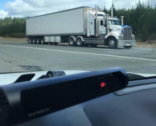 The Guardian in-cabin infrared camera on a dashboard of a truck, will set off an alarm after 1.5...