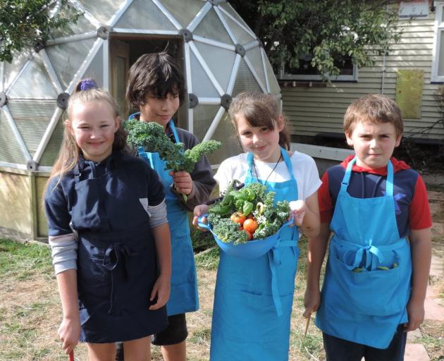 Proudly displaying produce harvested from the school garden for their Garden to Table session are (from left) Chloe Freeman (9), Tano Parker (9), Tayla Cornish (9) and Jacob Balloch (9). Photos: Charmian Smith