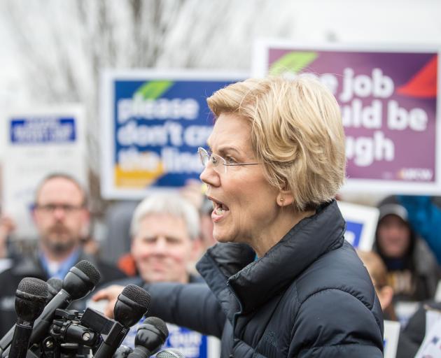 Democratic Presidential hopeful Elizabeth Warren speaks to media after joining striking Stop &...