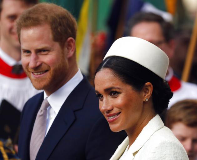 Britain's Prince Harry and Meghan, the Duchess of Sussex leave after the Commonwealth Service at...
