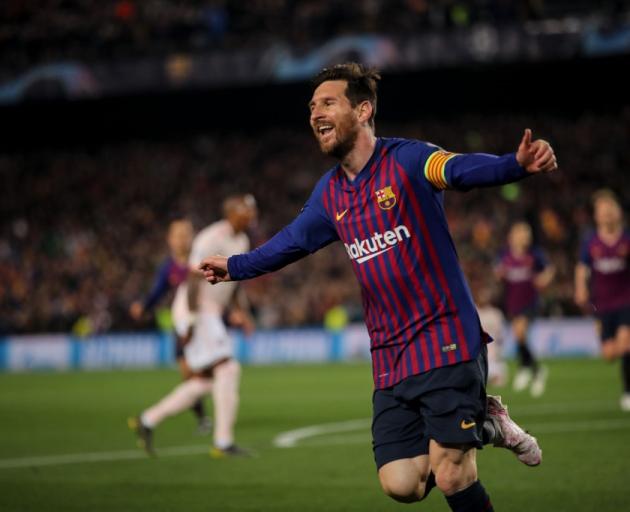 Lionel Messi celebrates one of two goals against Manchester United this morning. Photo: Getty Images