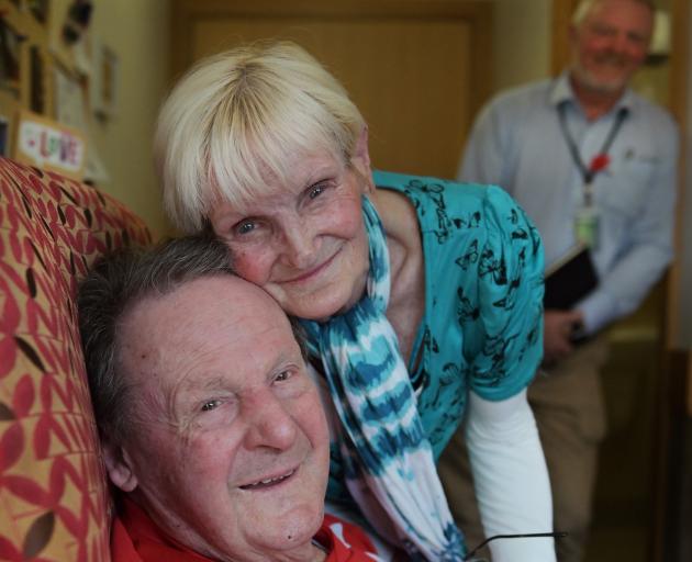 World War 2 veteran and dementia patient Neil Harper (97) and  wife Laurel, who he remembers thanks to her perfume,  watched by RSA support adviser Niall Shepherd, who found new bottles of the scent when it stopped being sold. Photo: Christine O'Connor