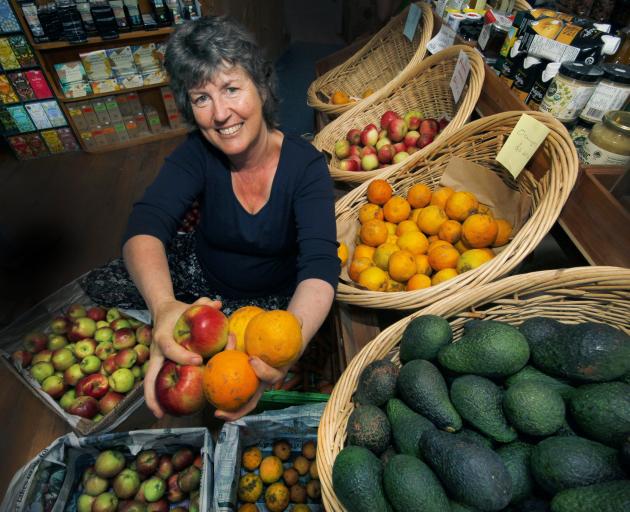 Robyn Guyton in the Riverton Environmental Centre with fruit that has been grown naturally. Spots...