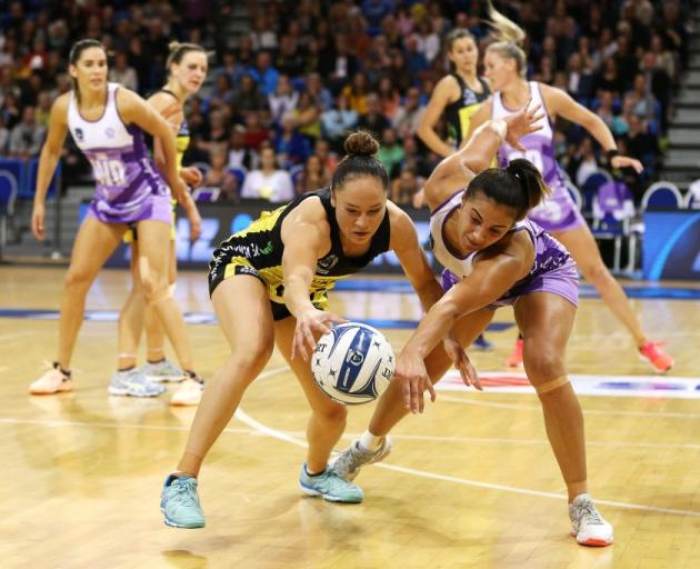 Whitney Souness and Holly Fowler compete for a loose ball during the Central Pulse's win over the...