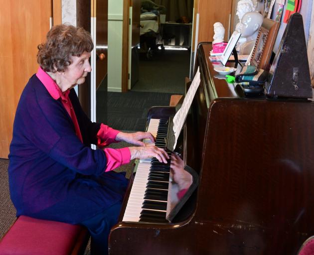 Marie Millar plays Strangers In The Night on the piano in her room at Radius Fulton.PHOTO: LINDA...