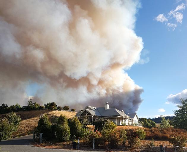 Guy Mollett took this photo, with smoke billowing from the wildfire burning just over the ridge...