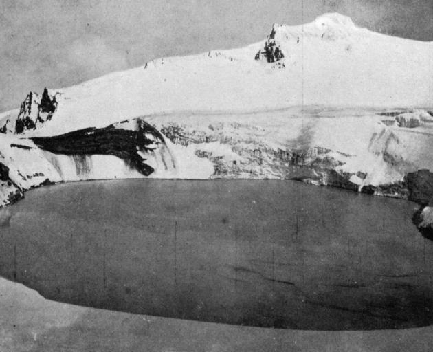 The crater lake on the summit of Mt Ruapehu, North Island. The steep sides are covered with snow...