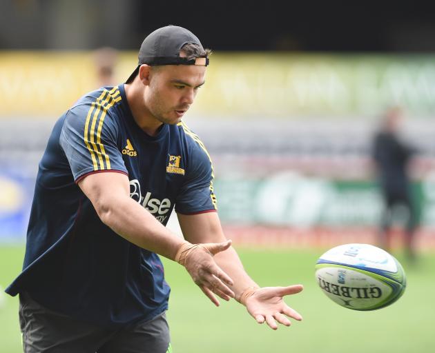 Highlanders lock Tom Franklin passes the ball during a training session at Forsyth Barr Stadium...