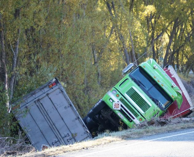 A Summerland freight truck in a ditch after it crashed at the bottom of Cluden Hill in the Lindis...