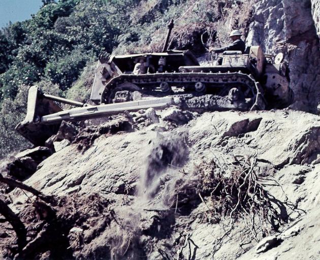 A bulldozer during the creation of the Haast road in the early 1960s. PHOTOS: TAS SMITH/ODT FILES