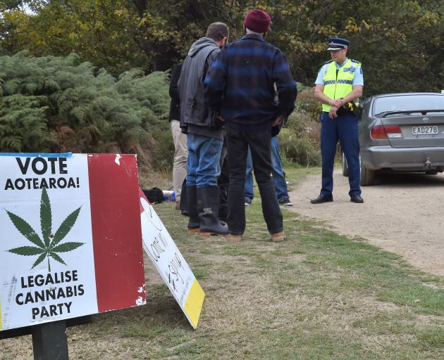 Police and council staff issue a trespass notice to the organisers of the Harvest Festival near...