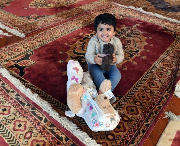 Playing with soft toys left outside the Al Huda mosque in Dunedin after last month's terror...