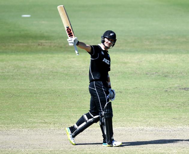 New Zealand XI batsman Will Young celebrates scoring a century during the World Cup warm-up match...