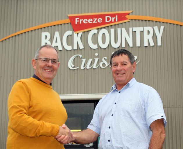 Marking the sale of Back Country Foods to Invercargill family business George Wilson Group are Back Country Foods general manager John McGrath (left) and Murray Wilson, owner of George Wilson Group, in Invercargill yesterday. Photo: Laura Smith