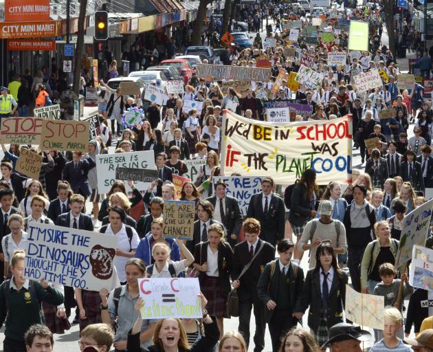 Striking high school pupils and supporters march up George St to the Octagon last Friday to...