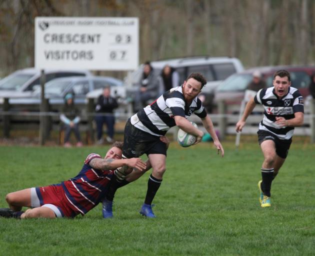 Crescent captain and first five-eighth Harley McHardy looks to offload the ball after being...