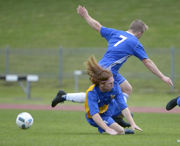 University's Tim O'Farrell challenges Mosgiel's Cam Anderson (on ground) in a top-of-the-table...