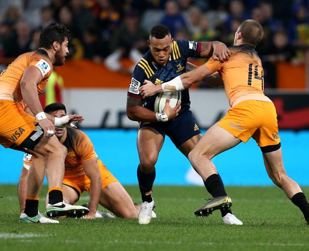 Tevita Li fights in the tackle during the Highlanders' close win over the Jaguares at Forsyth...