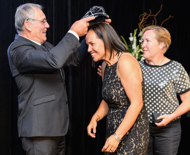 Former Otago player Maree Edwards receiving her Black Ferns cap from New Zealand Rugby president...