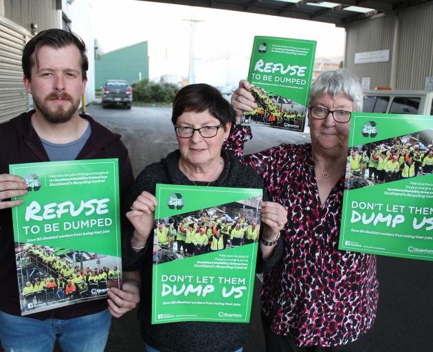 Save Southland disAbility Enterprises campaigners (from left) Tony Stewart, Lynda Mooij and Rae Burt will be spreading posters throughout Southland today as part of a campaign to keep a regional waste contract. Photo: Jono Edwards