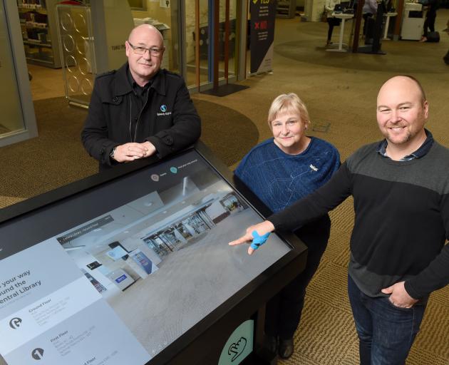 At the University of Otago's Central Library are (from left) Speedy Signs business development...