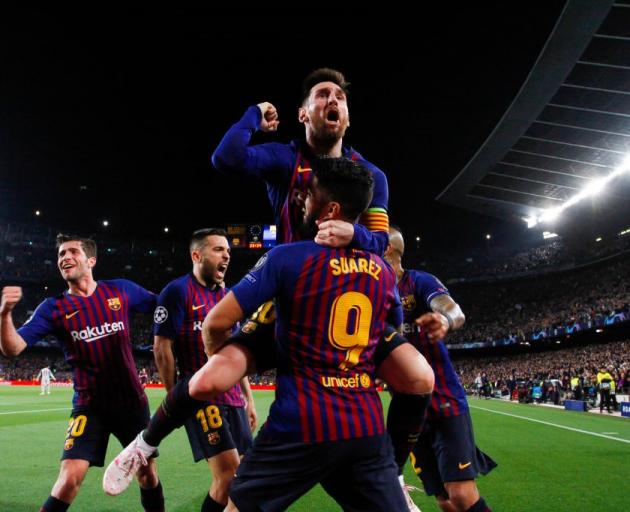 Lionel Messi celebrates scoring during Barcelona's 3-0 win over Liverpool this morning. Photo:...