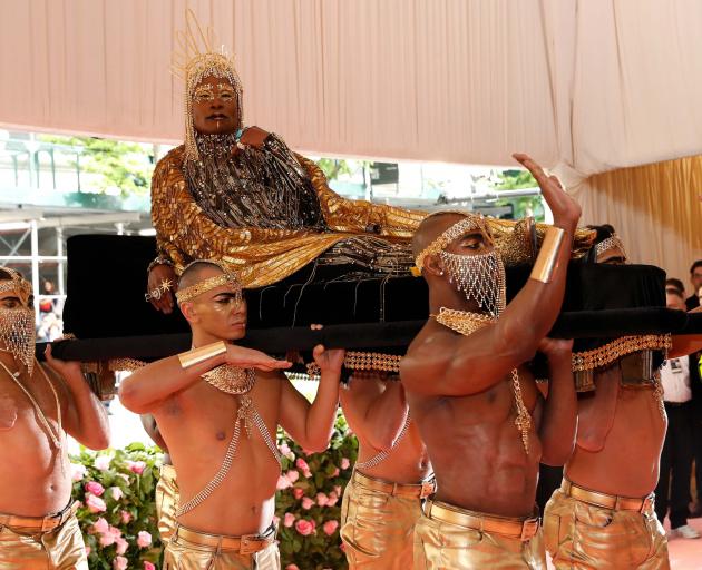 Performer Billy Porter, dressed in head-to-toe gold, summoned ancient Egypt when he was carried into the gala on a litter by six shirtless men. Photo: Reuters