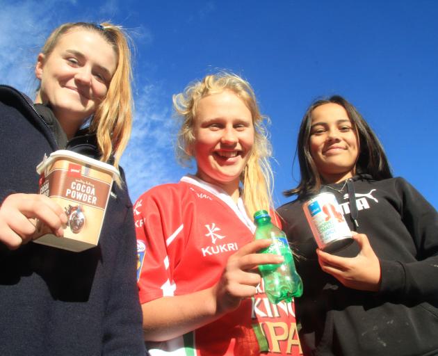 Showing a few items that should be recycled are East Otago High School year 9 pupils (from left) Sarah Hay, of Macraes Flat, Abigail Paton, of Dunback, and Shayla Raharaha-Baird, of Karitane, at the Waitaki Resource Recovery Park, in Oamaru, yesterday. Ph