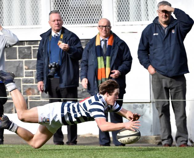Otago Boys' High School First XV winger Michael Manson scores after chasing a kick at...