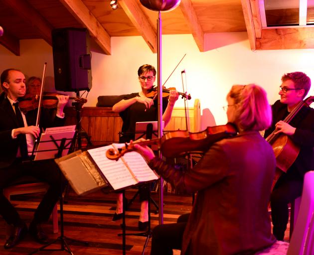 A string quartet of (from left) violinists Benjamin Baker and Justine Cormack, viola player...