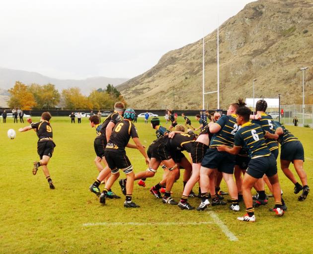 Mt Aspiring College halfback Ethan Kerr clears from a scrum near Wakatipu High School's line during his side's 24-22 victory in Frankton yesterday. Photo: Guy Williams