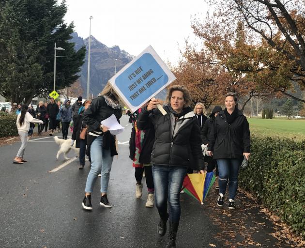 More than 100 teachers, principals and parents are marching in Queenstown. Photo: Daisy Hudson