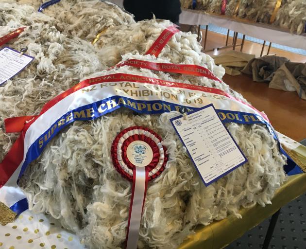 Tekapo farmers Will and Emily Murray claimed the ribbon for supreme champion fine wool fleece with their merino fleece at the Golden Fleece. 