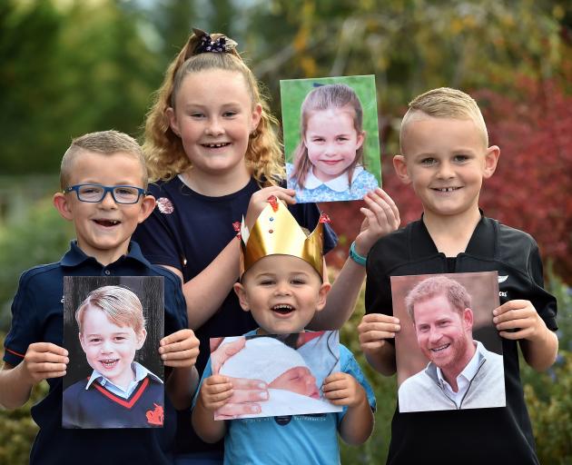 Putting on their best royal poses are (from left) George, Charlotte, Archie and Harry Stafford,...