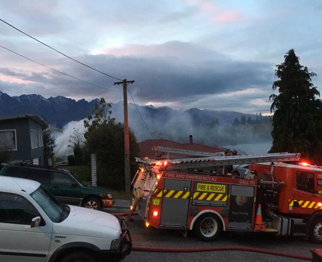 Smoke rises from a sleepout fire in Suburb St. Photo: Miranda Cook