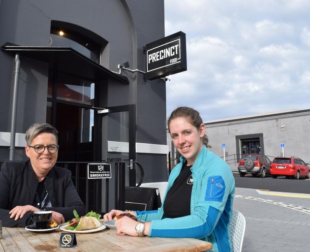 Precinct Food owner Liz Christensen (left) and chef Louise Evans eat lunch in the smokefree outdoor dining area of the eatery in Dunedin's warehouse precinct. Photo: Shawn McAvinue Precinct Food owner Liz Christensen (left) and chef Louise Evans eat lunch in the smokefree outdoor dining area of the eatery in Dunedin's warehouse precinct. Photo: Shawn McAvinue