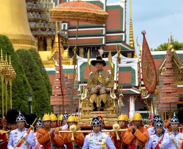 Thiland's newly crowned King Maha Vajiralongkorn greeted his subjects on Sunday in a royal procession. Photo: Committee on Public Relations of the Coronation of King Rama X/Handout via Reuters