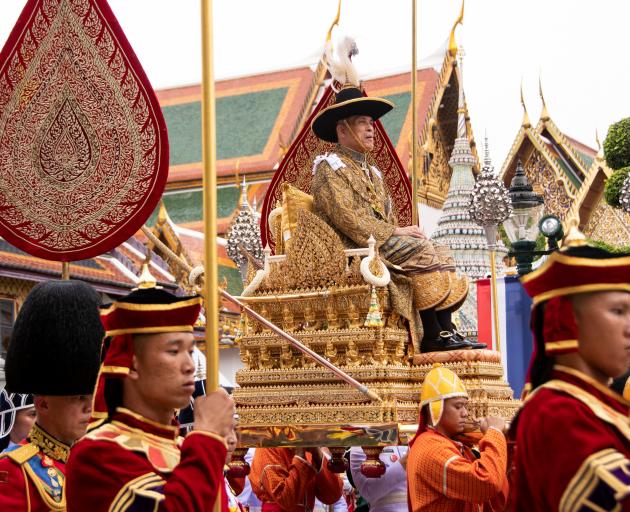 Thailand's King Maha Vajiralongkorn is transported on the royal palanquin. Photo: Committee on Public Relations of the Coronation of King Rama X/Handout via Reuters