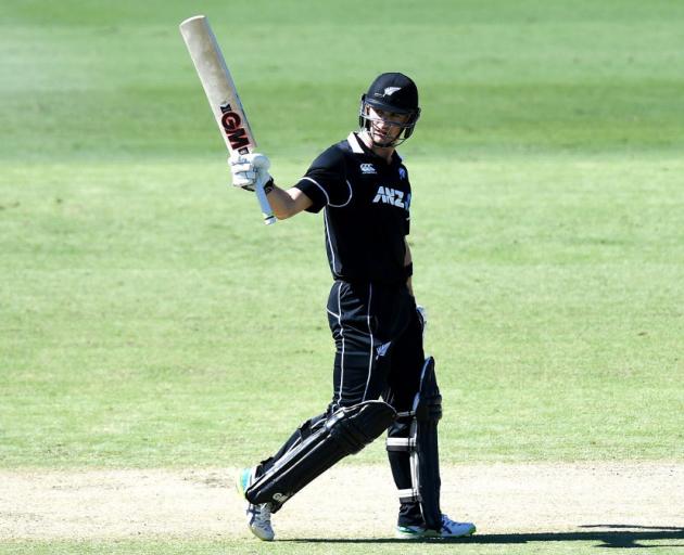 Will Young raises his bat during the New Zealand XI game against an Australia XI on Monday. Photo...