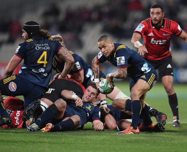 Highlanders halfback Aaron Smith about to clear the ball from a ruck.PHOTO: GETTY IMAGES