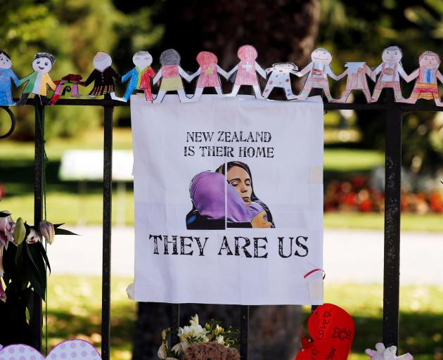 A poster hangs at a memorial site in front of Christchurch Botanic Gardens for victims of the...
