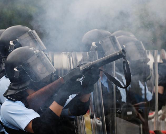 Hong Kong police fire tear gas at protesters during the ongoing demonstrations. Photo: Reuters 