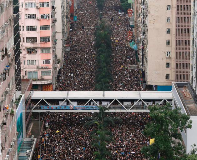 Protesters attend a demonstration demanding Hong Kong's leaders to step down and withdraw the...