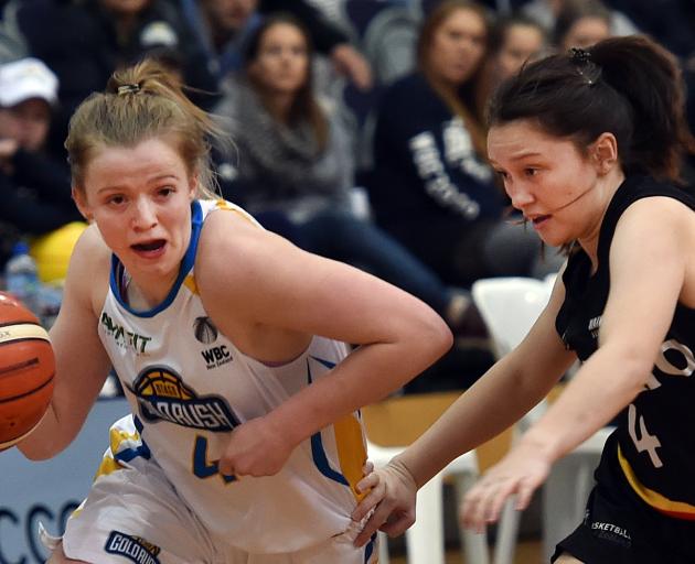 Otago Gold Rush guard Aleisha Ruske dribbles past Quaye Walker-Eketone of the Waikato Wizards...