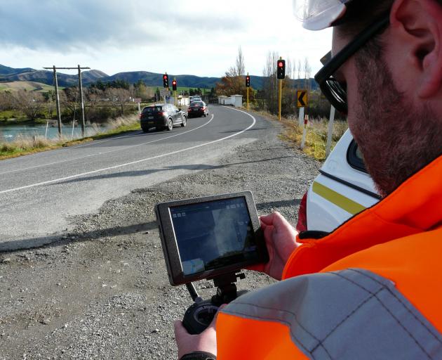 NZTA coastal Otago maintenance contract manager Nick Rodger uses a new drone-mounted zoom camera...