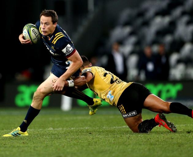 Ben Smith on the run for the Highlanders against the Hurricanes last week. Photo: Getty Images