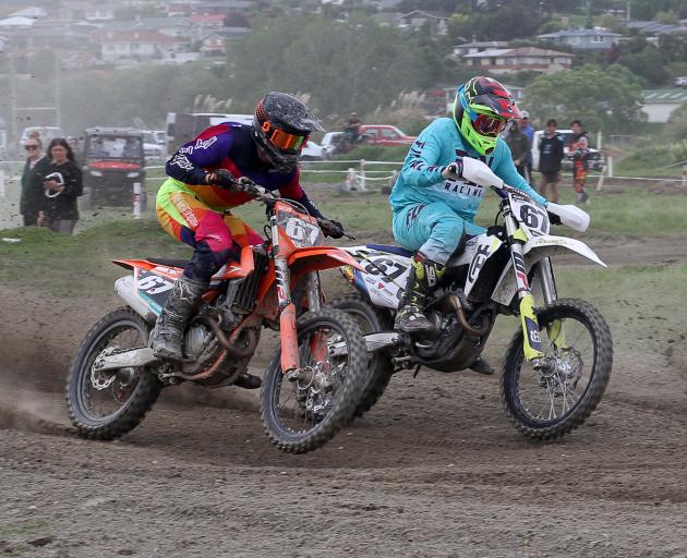 Madison Latta, of Balclutha (right), passes Liam Shepherd, of Invercargill, on his way to MX2 Southern Series victory at Balclutha last year. Latta is a finalist in tonight’s Clutha Licensing Trust Sports Awards. Photo: John Cosgrove